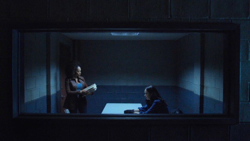 Misty and Jessica in a police interrogation room.