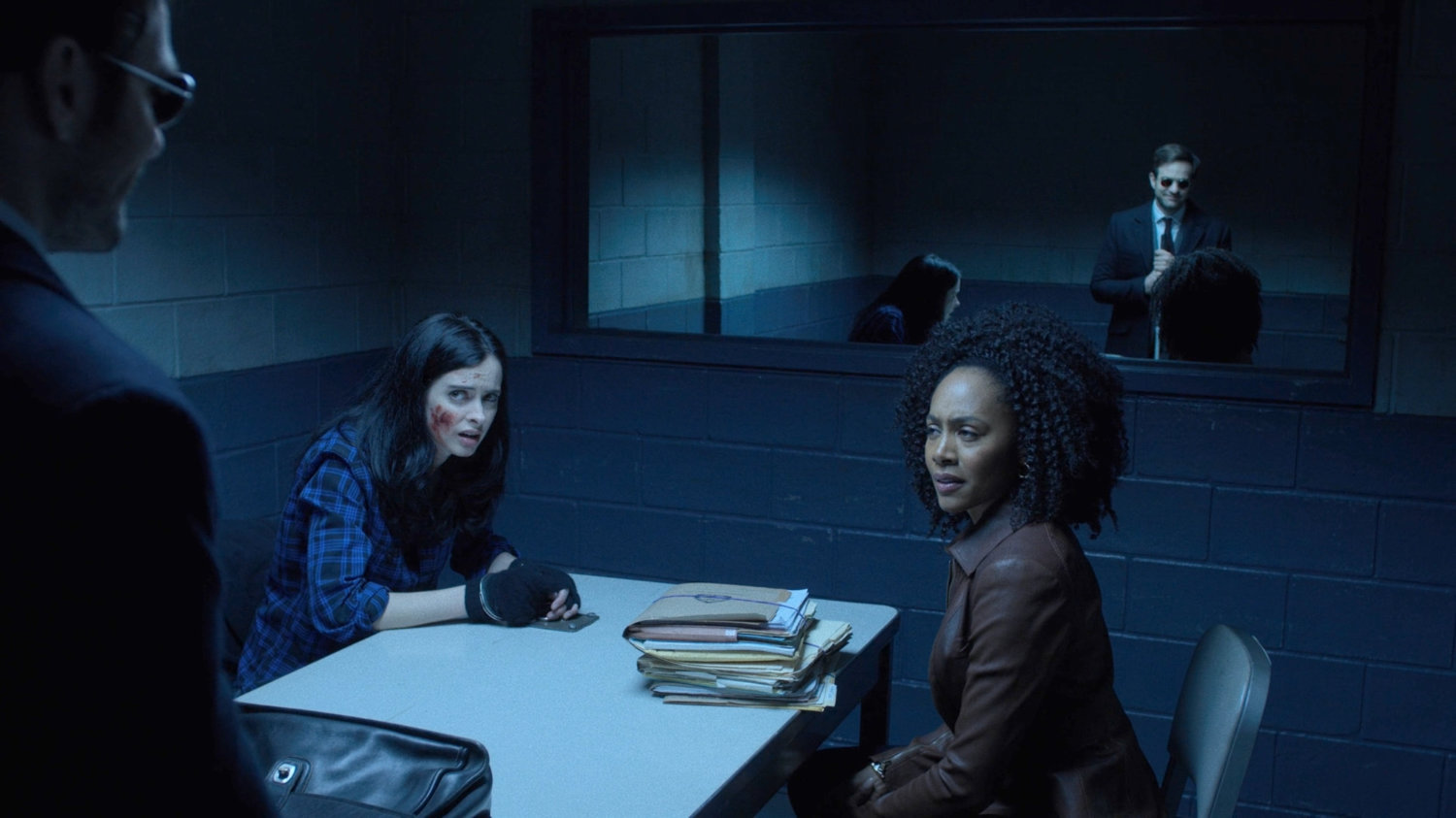 Matt, Misty, and Jessica in a police interrogation room.