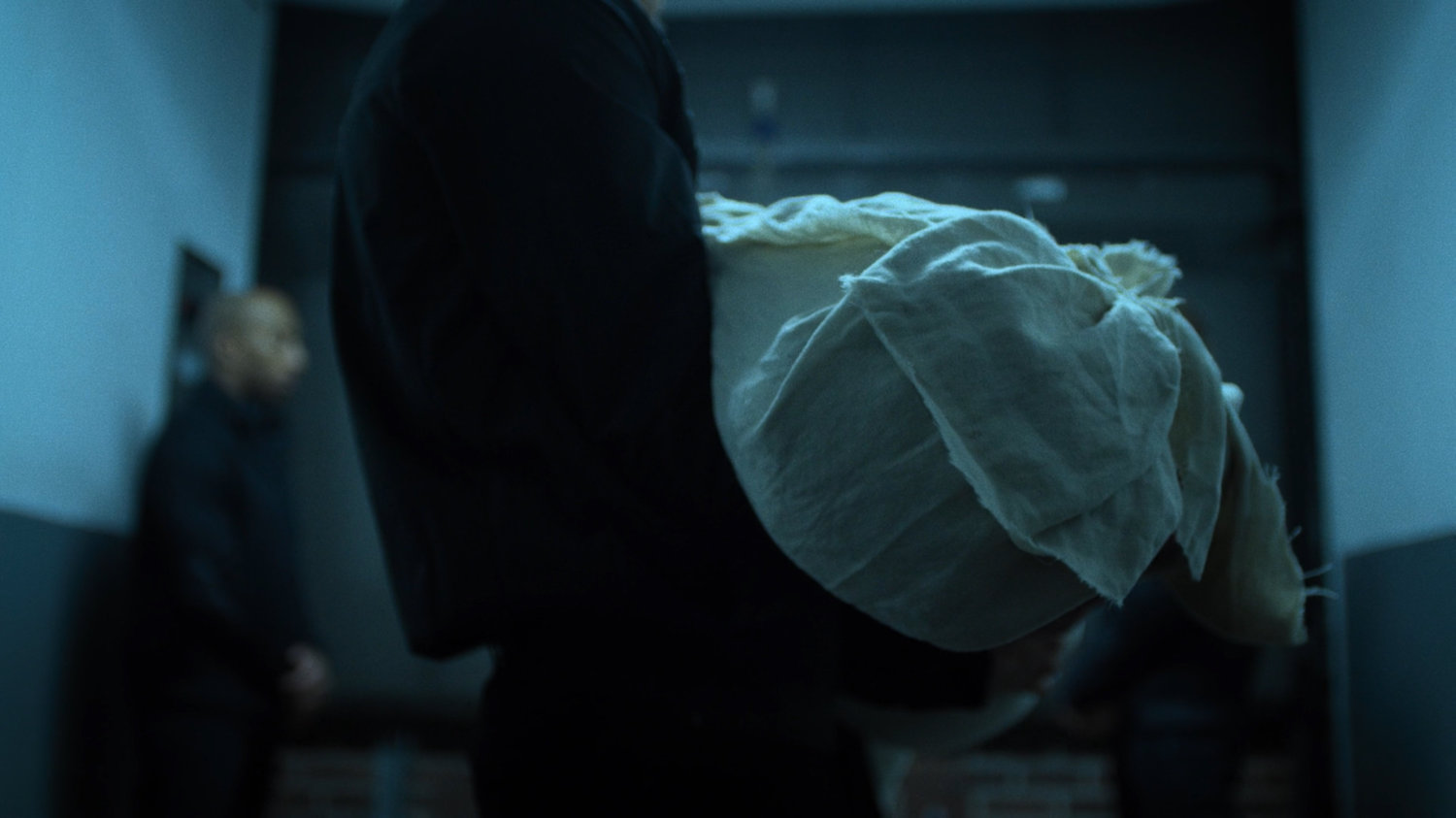 Hand members carry the body of Black Sky.