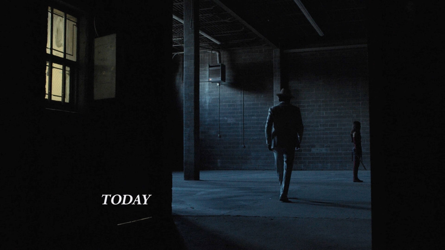 White Hat enters a dark warehouse.