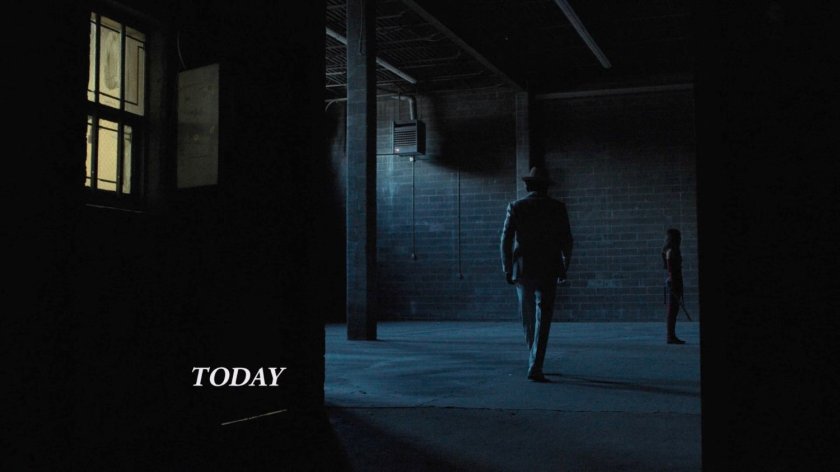 White Hat enters a dark warehouse.