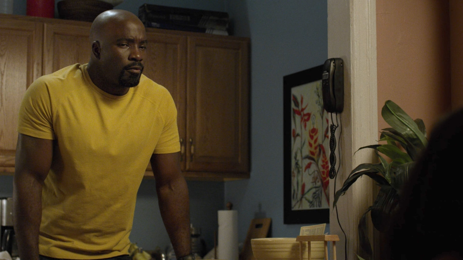 Luke in Claire Temple's apartment.