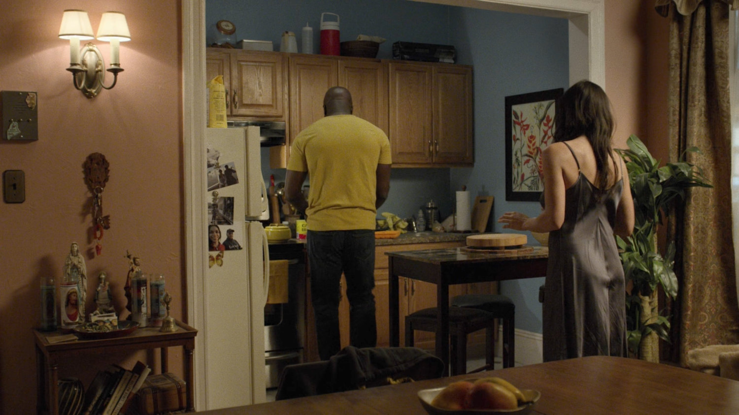 Luke and Claire in her apartment.