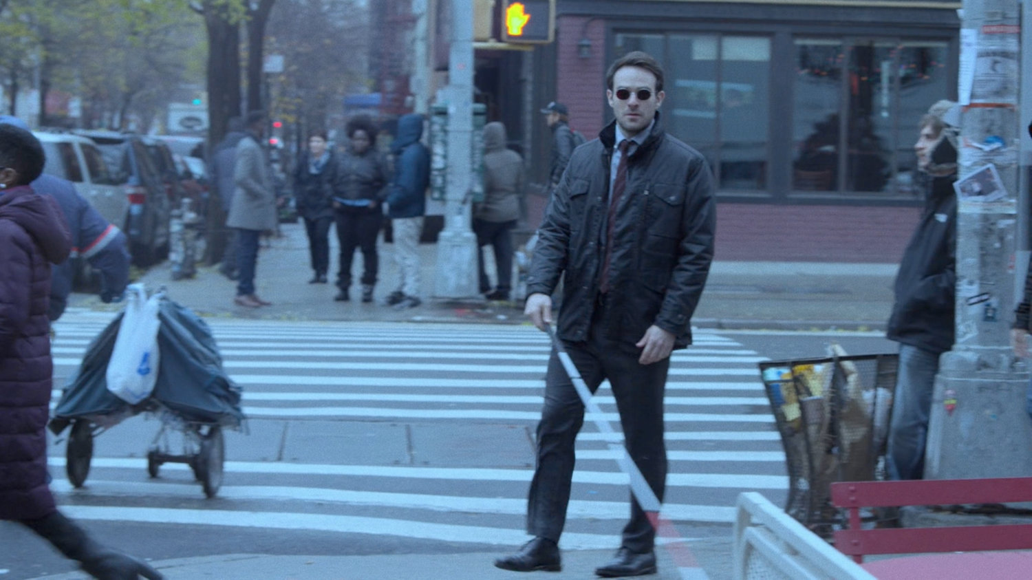 Matt turning a corner on a sidewalk.