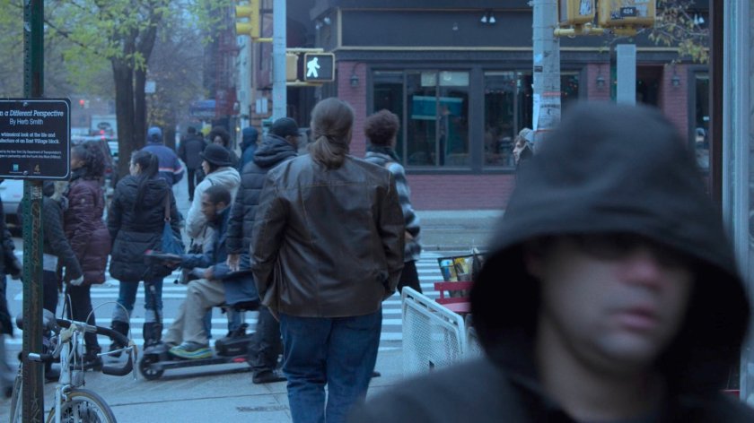 A crowded sidewalk corner.