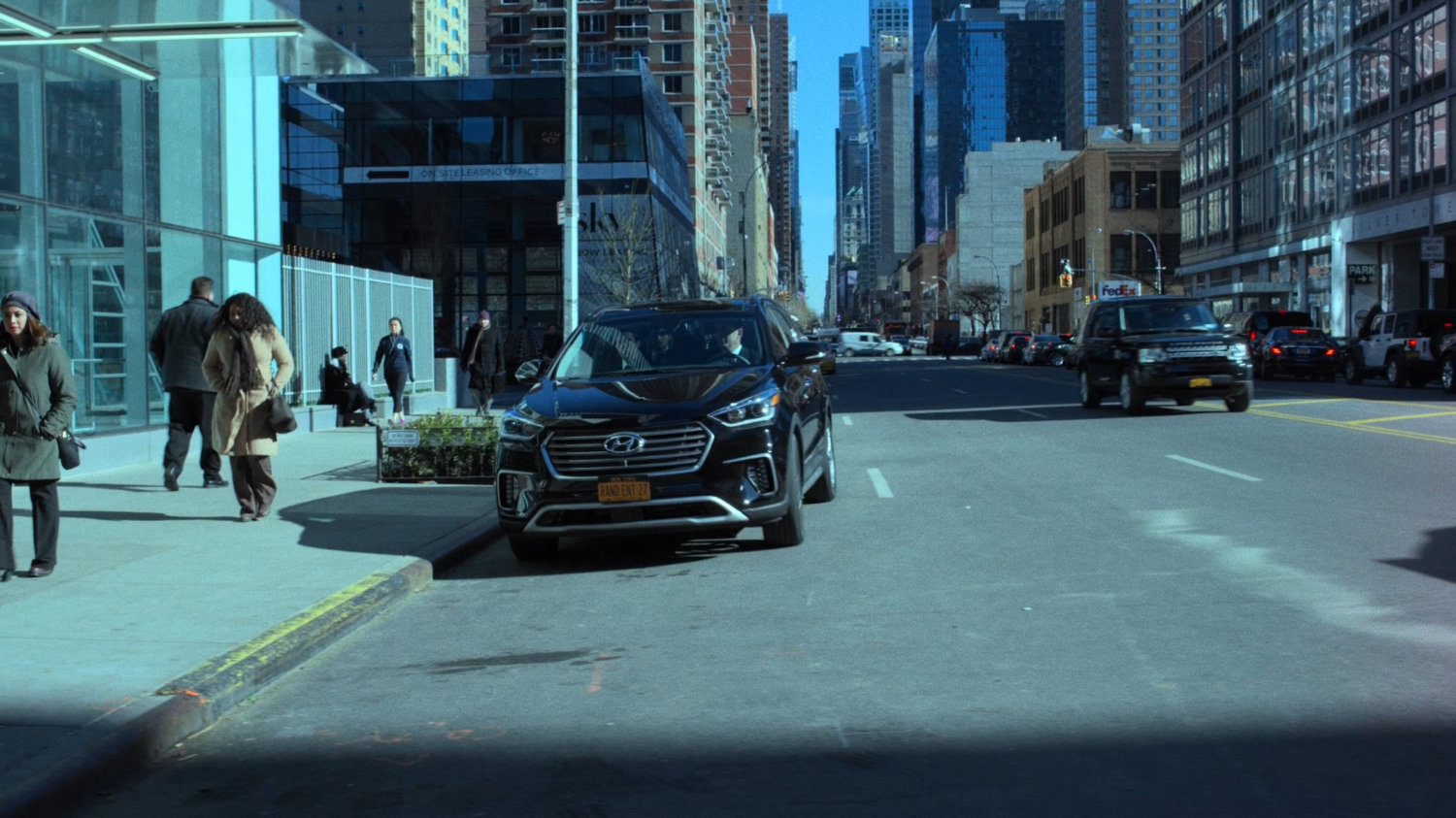 Danny Rand's car pulls up outside Midland Circle Financial skyscraper.
