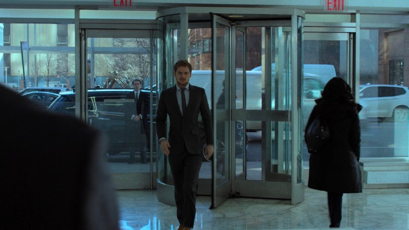 Danny enters the lobby of Midland Circle Financial skyscraper.