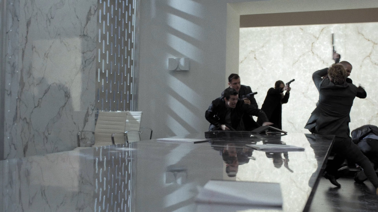 Gun toting members fight Danny in the boardroom of Midland Circle Financial skyscraper.