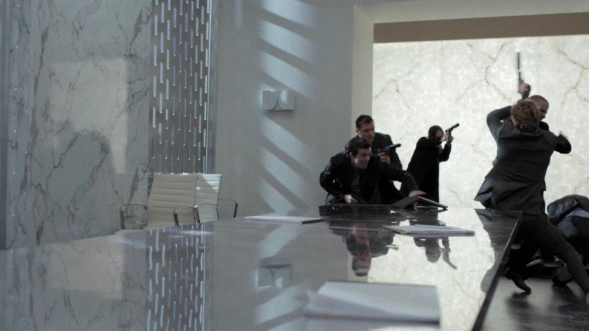 Gun toting members fight Danny in the boardroom of Midland Circle Financial skyscraper.