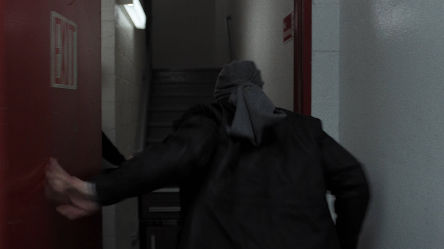 Matt runs into stairwell of Midland Circle Financial skyscraper.