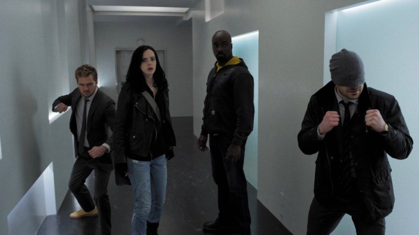 The Defenders gather in a hallway of Midland Circle Financial skyscraper.