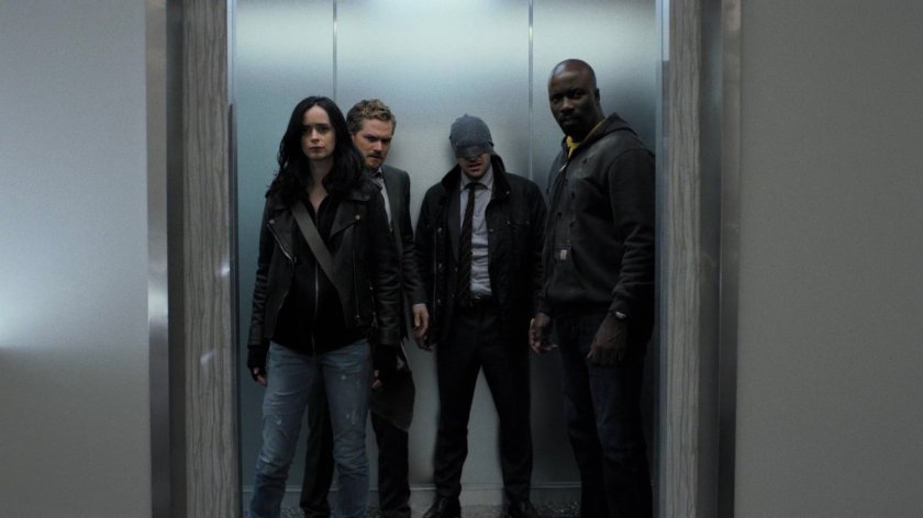 The Defenders in an elevator at Midland Circle Financial skyscraper.