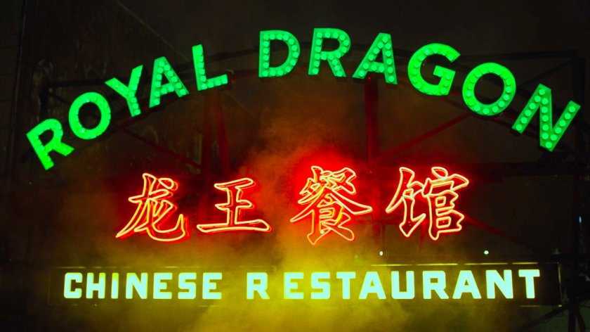 Sign on top of rooftop for the Royal Dragon Chinese Restaurant.