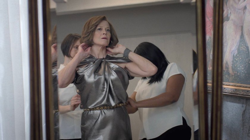 Alexandra getting dressed in the Hand compound.