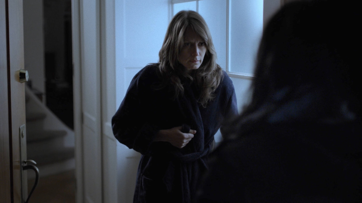 Michelle Raymond at the door to her brownstone.