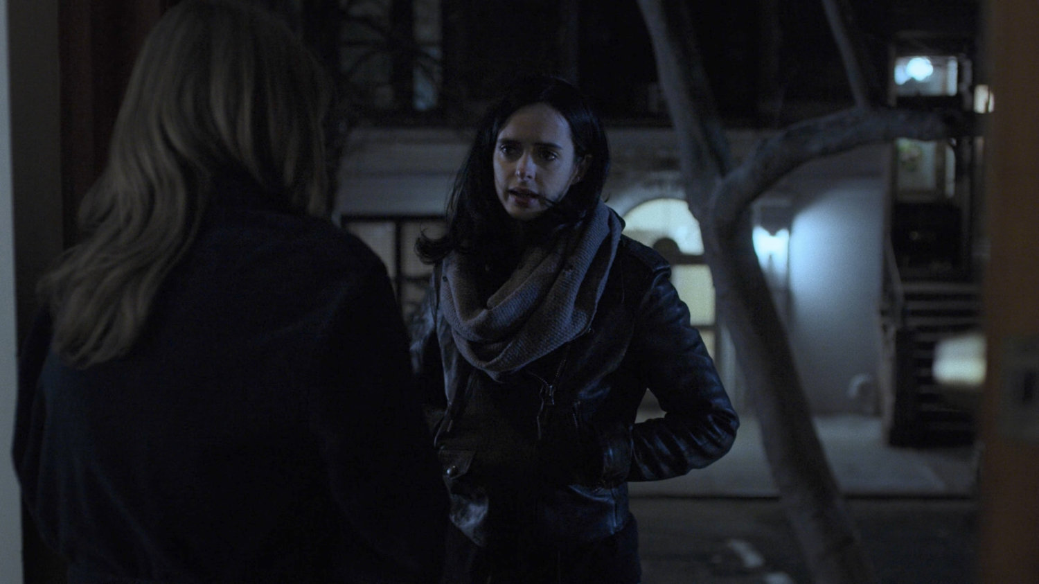 Michelle Raymond talking to Jessica at the door to her brownstone.
