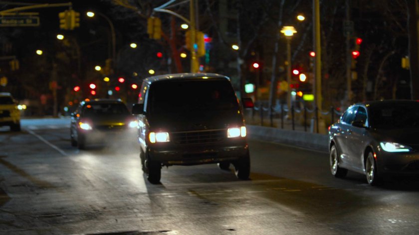 Sowande's van drives along a New York street at night.