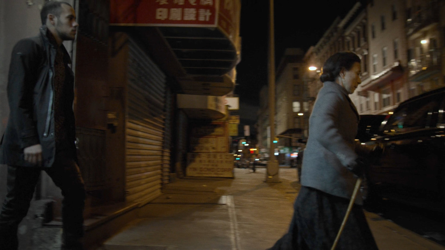 Madame Gao crosses a New York sidewalk.