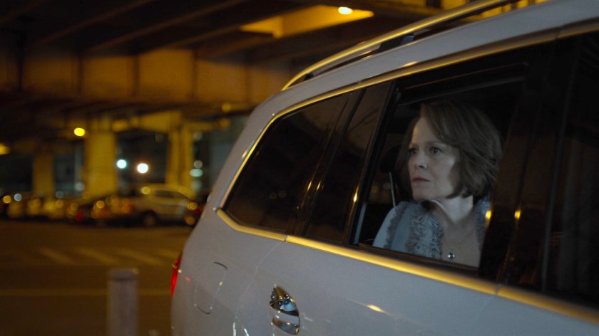 Alexandra watches the battle at the Royal Dragon Chinese Restaurant from her vehicle.