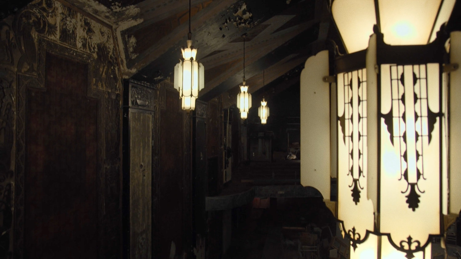 Chandeliers inside a derelict theater.