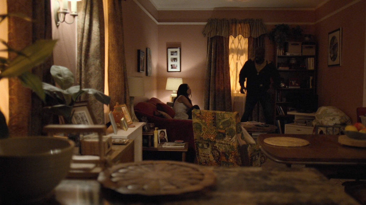 Luke and Claire in her apartment.