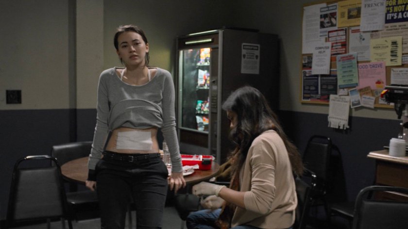 Claire bandaging Jessica in the 29th Precinct kitchen.