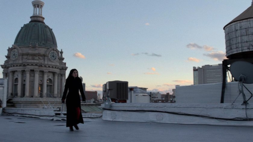 Elektra running across Matt's rooftop.