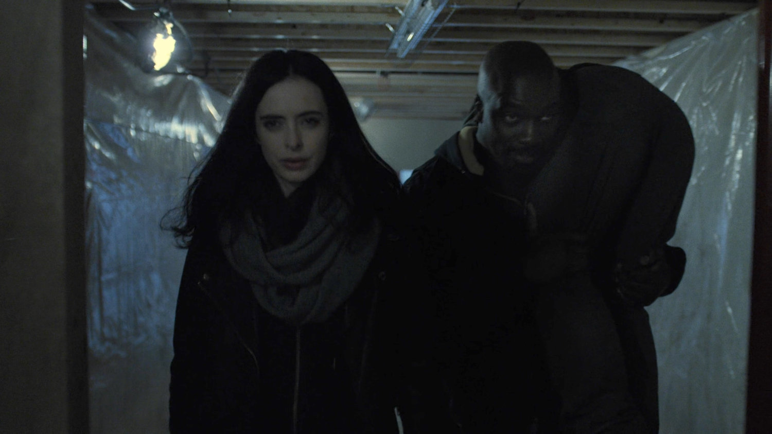 Luke carriers Danny as he and Jessica look for someplace to stash him in a dilapidated theater.