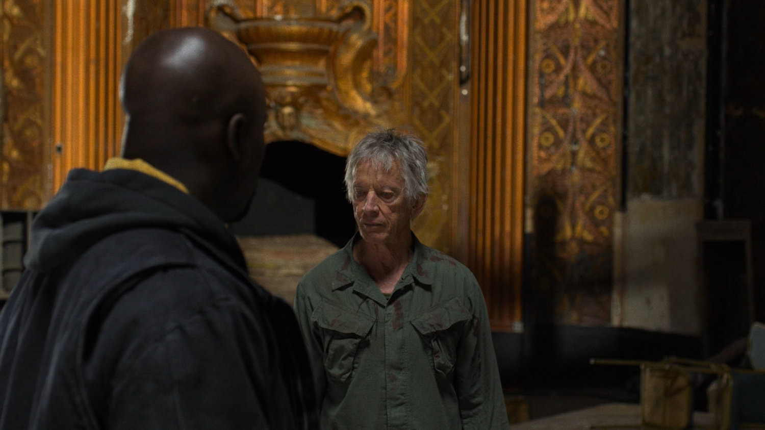 Luke and Stick in a dilapidated theater.