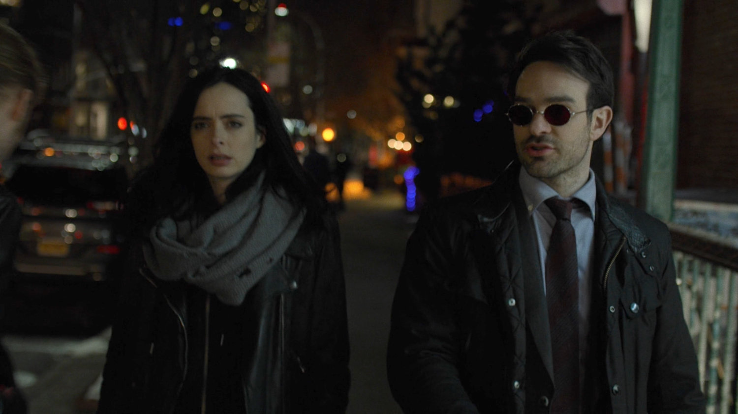 Jessica and Matt on nighttime sidewalk.