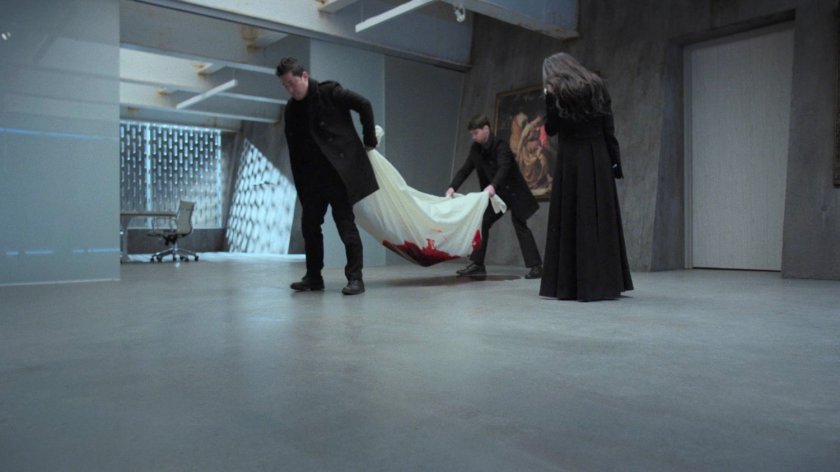 Hand guards move the dead body of Alexandra at the Hand Compound.