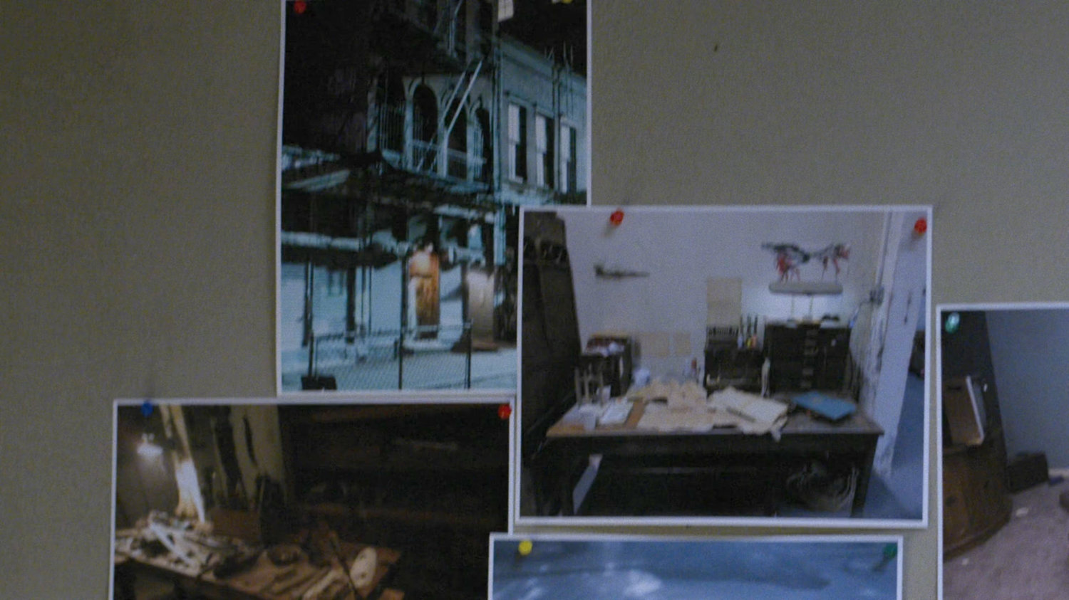 Pictures of crime scenes on the wall at the 29th Precinct.