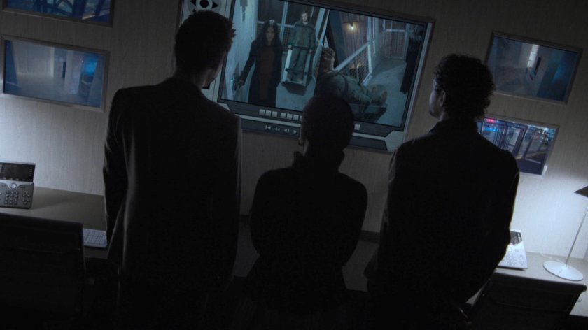 Murakami, Gao, and Bakuto watch security feeds of the Hand Compound.