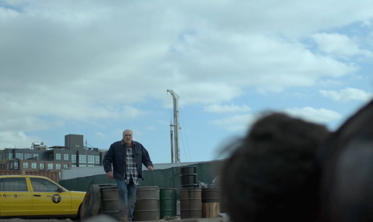 A taxi driver approach the unconscious Matt.