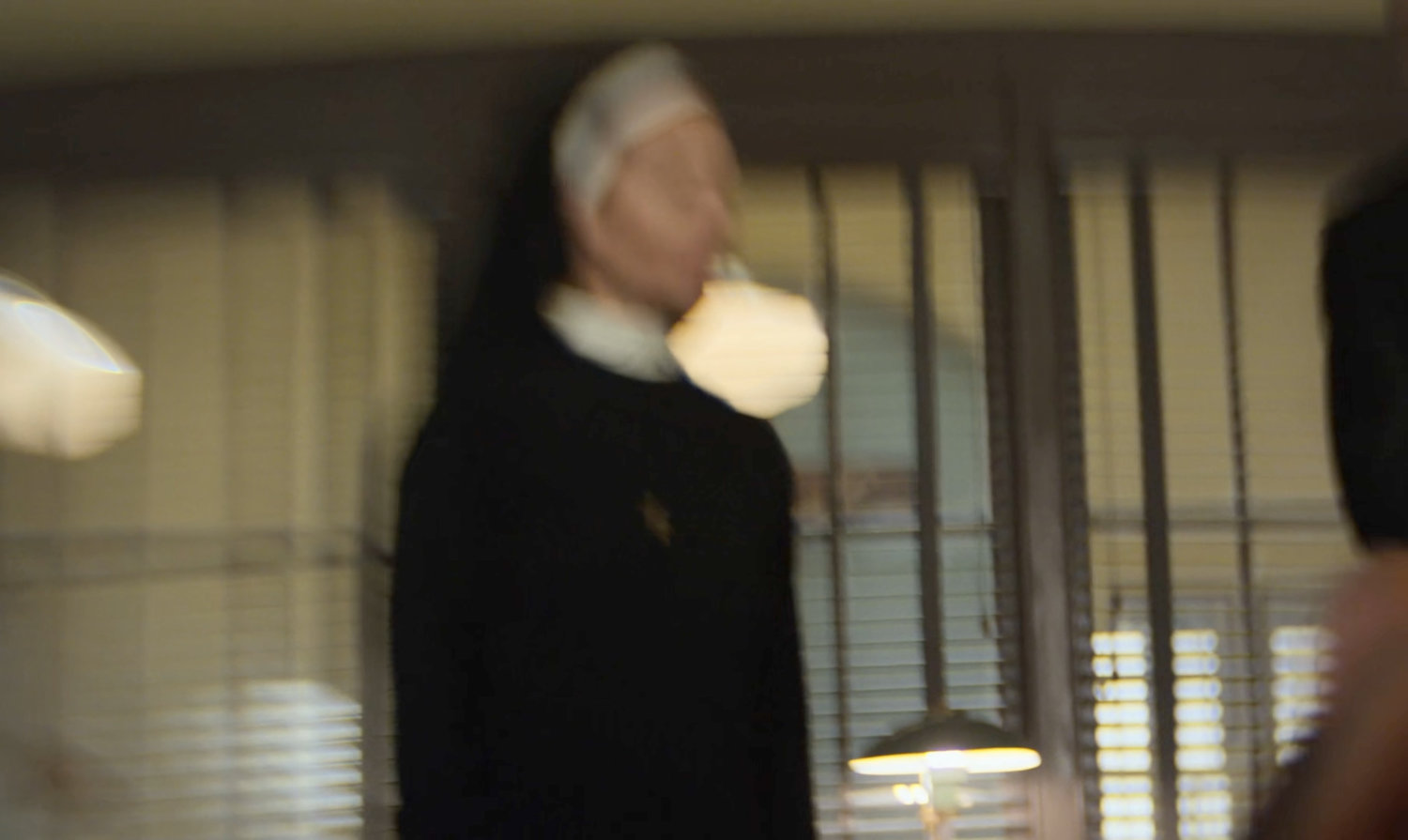 an out of focus nun at St. Agnes Orphanage.