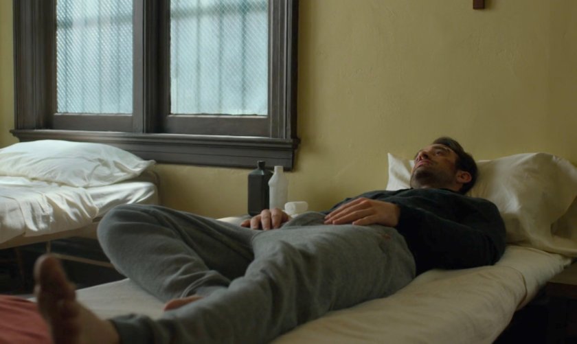 Matt in a bed at St. Agnes Orphanage.