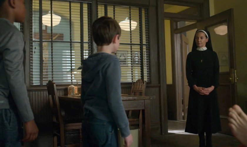 Maggie talks to two young boys at St. Agnes Orphanage.