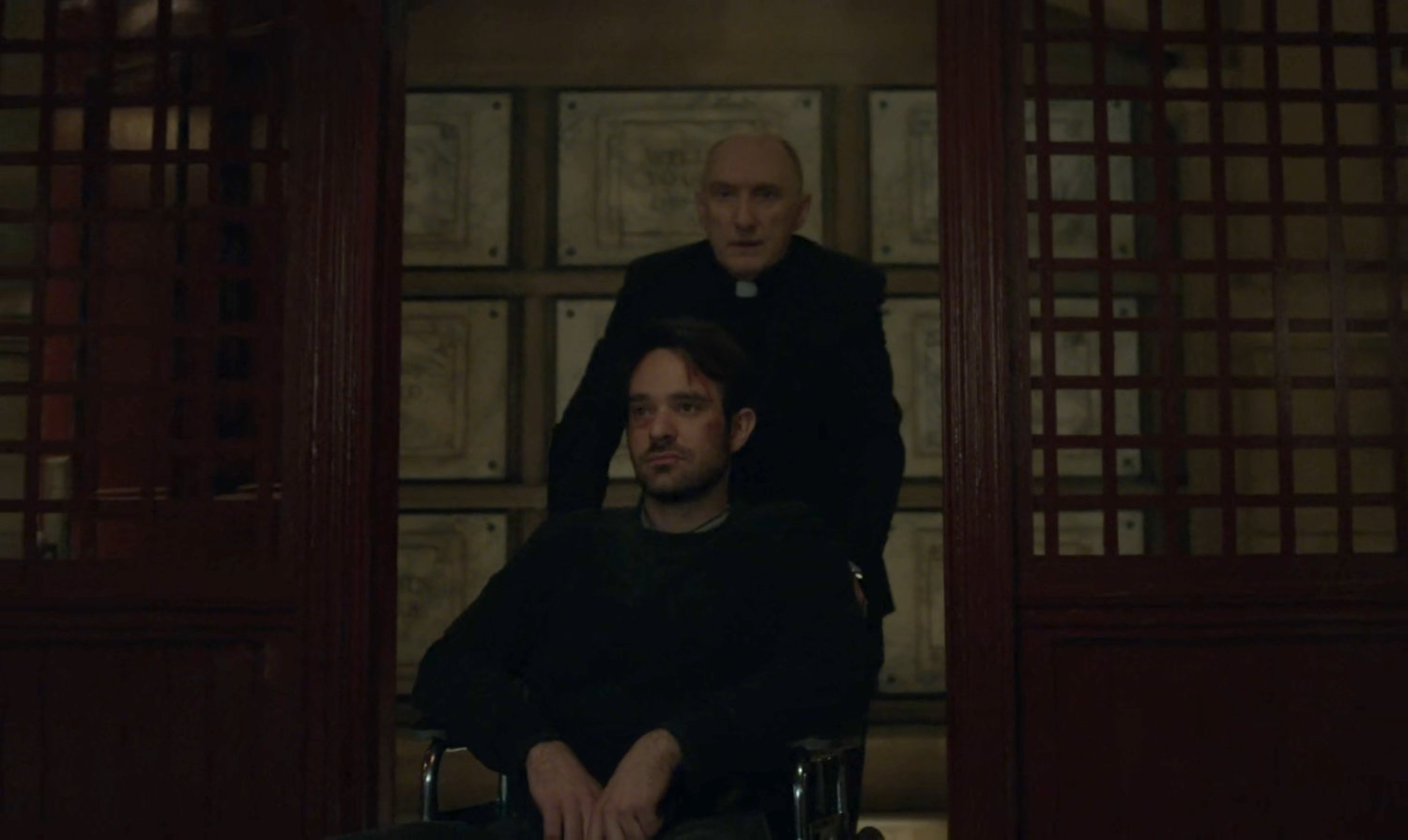Father Lantom wheels Matt into a space under the church.