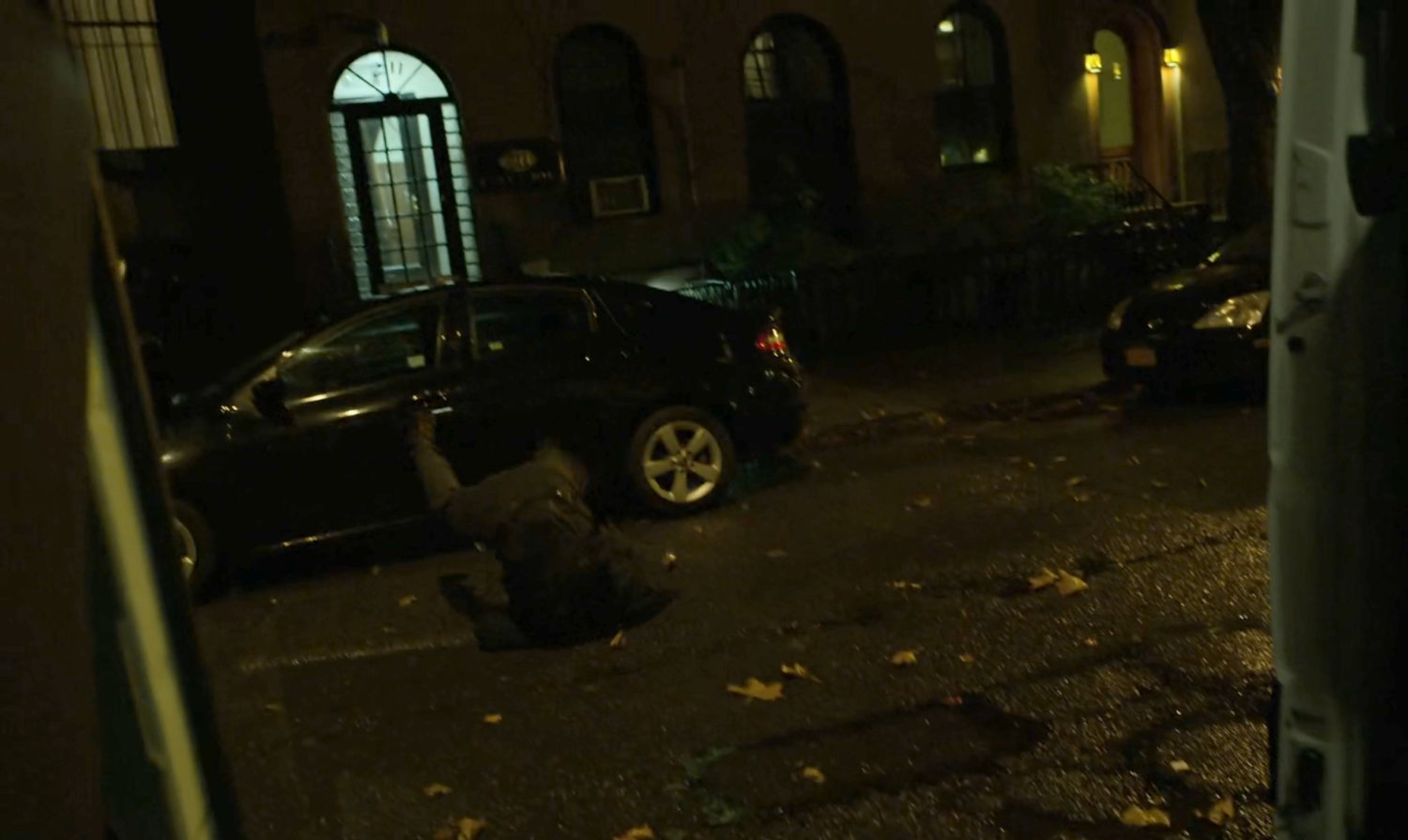 A kidnapper tumbling on a dark street.