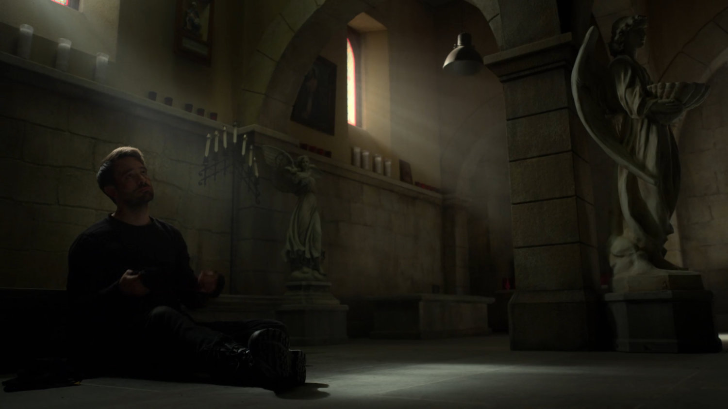Matt sitting alone in the church basement.