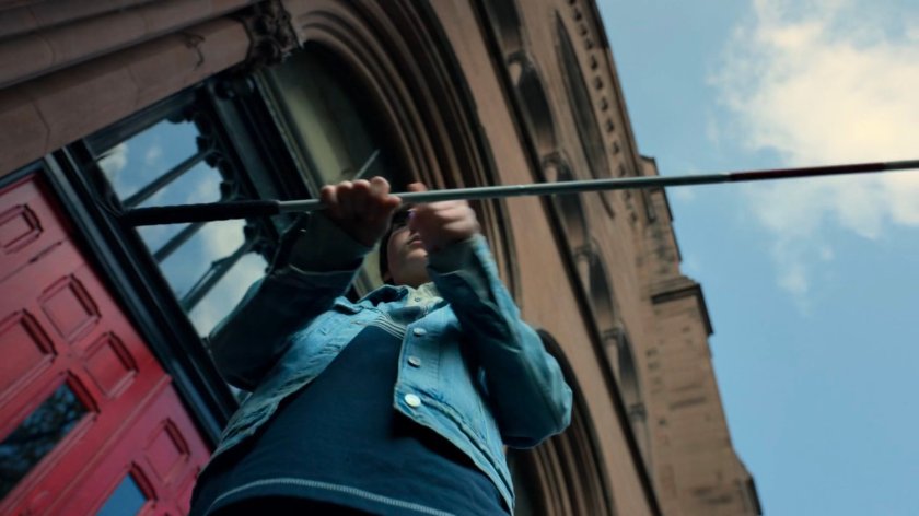 Young Matt twirls his cane outside the church.