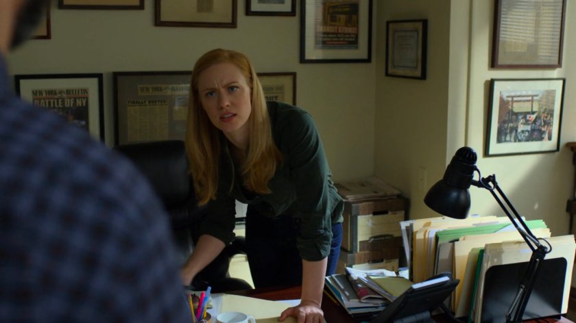 Karen talking to Ellison in her office at the New York Bulletin.
