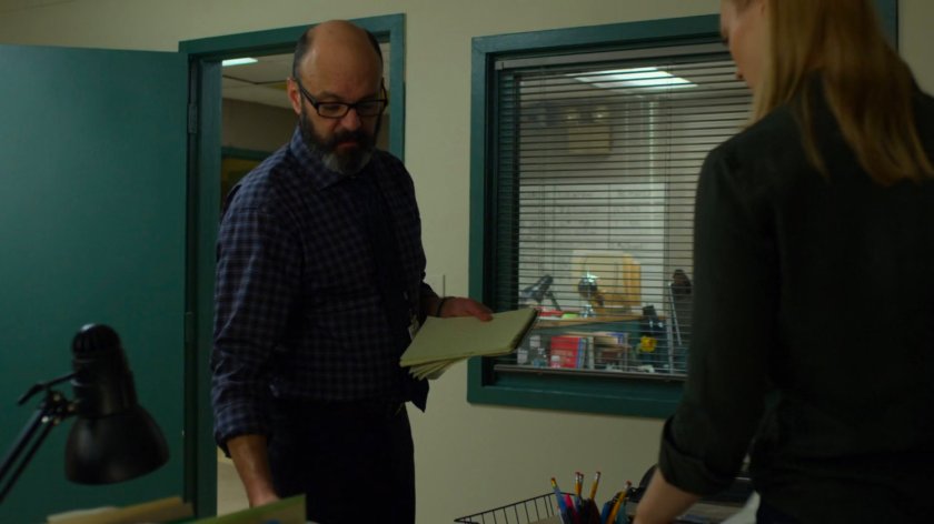Karen talking to Ellison in her office at the New York Bulletin.