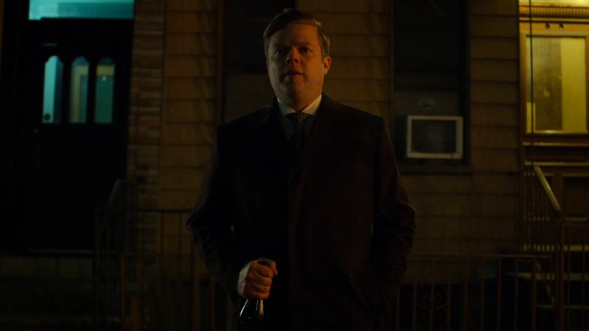 Foggy standing on a dark sidewalk.