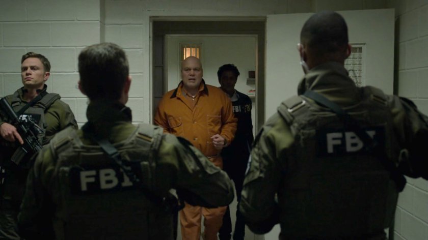 Nadeem leads Fisk out of penitentiary flanked by FBI SWAT Team.