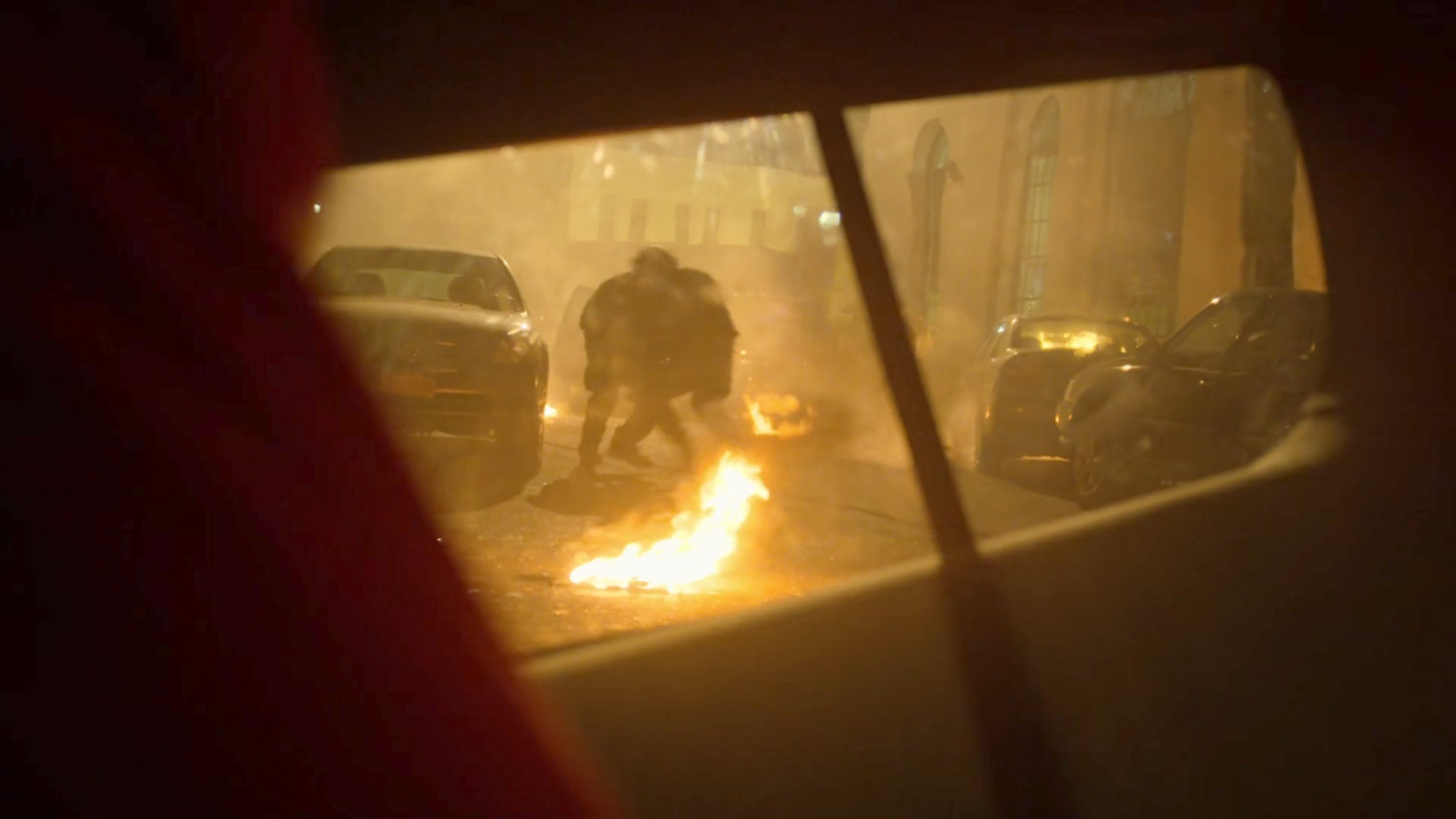 View of FBI agents outside SUV window in the aftermath of a car bombing.
