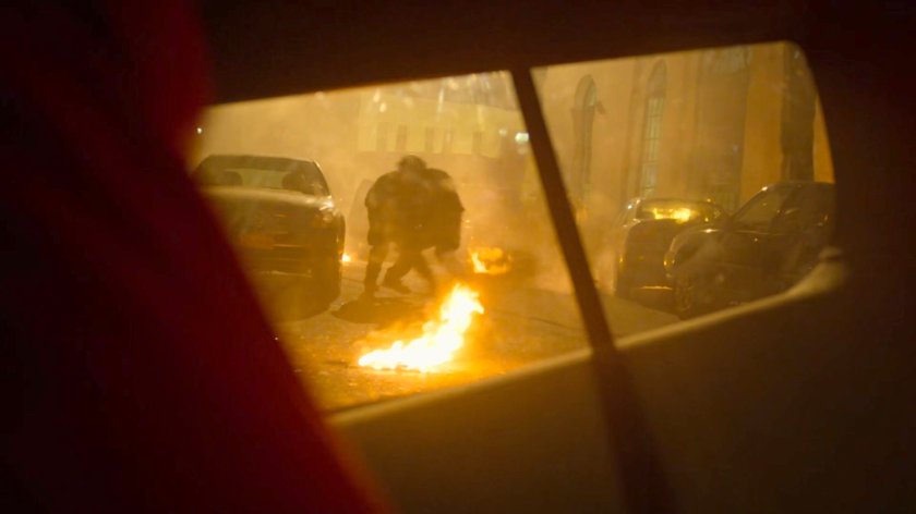 View of FBI agents outside SUV window in the aftermath of a car bombing.