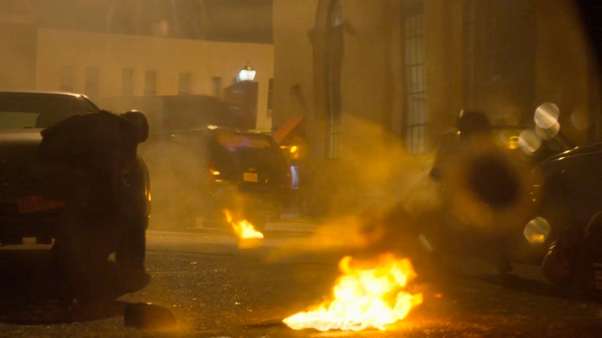 View of FBI agents outside SUV window in the aftermath of a car bombing.