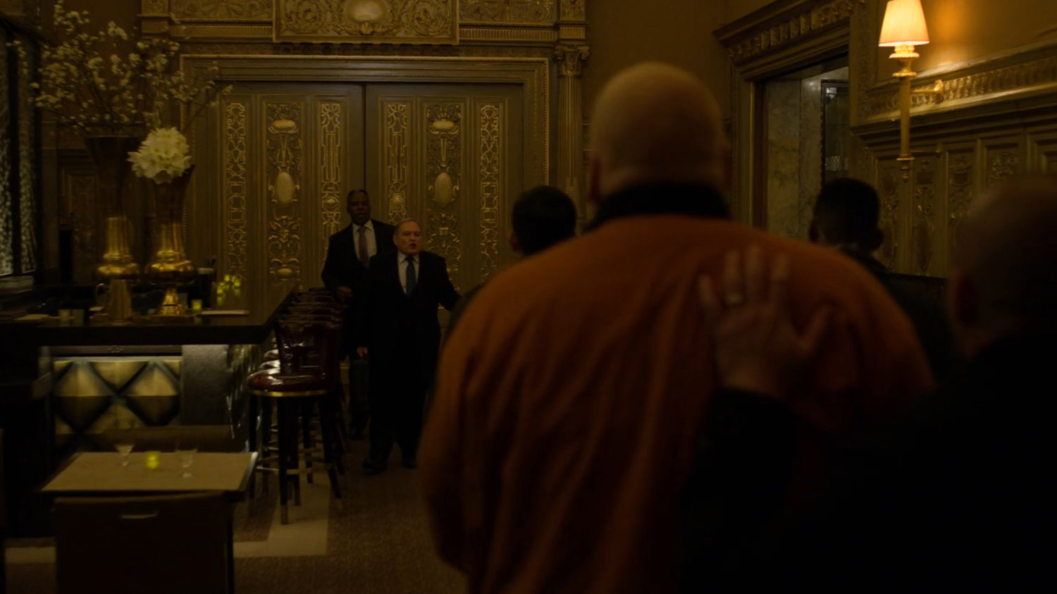 Fisk being escorted through the bar the Presidential Hotel.