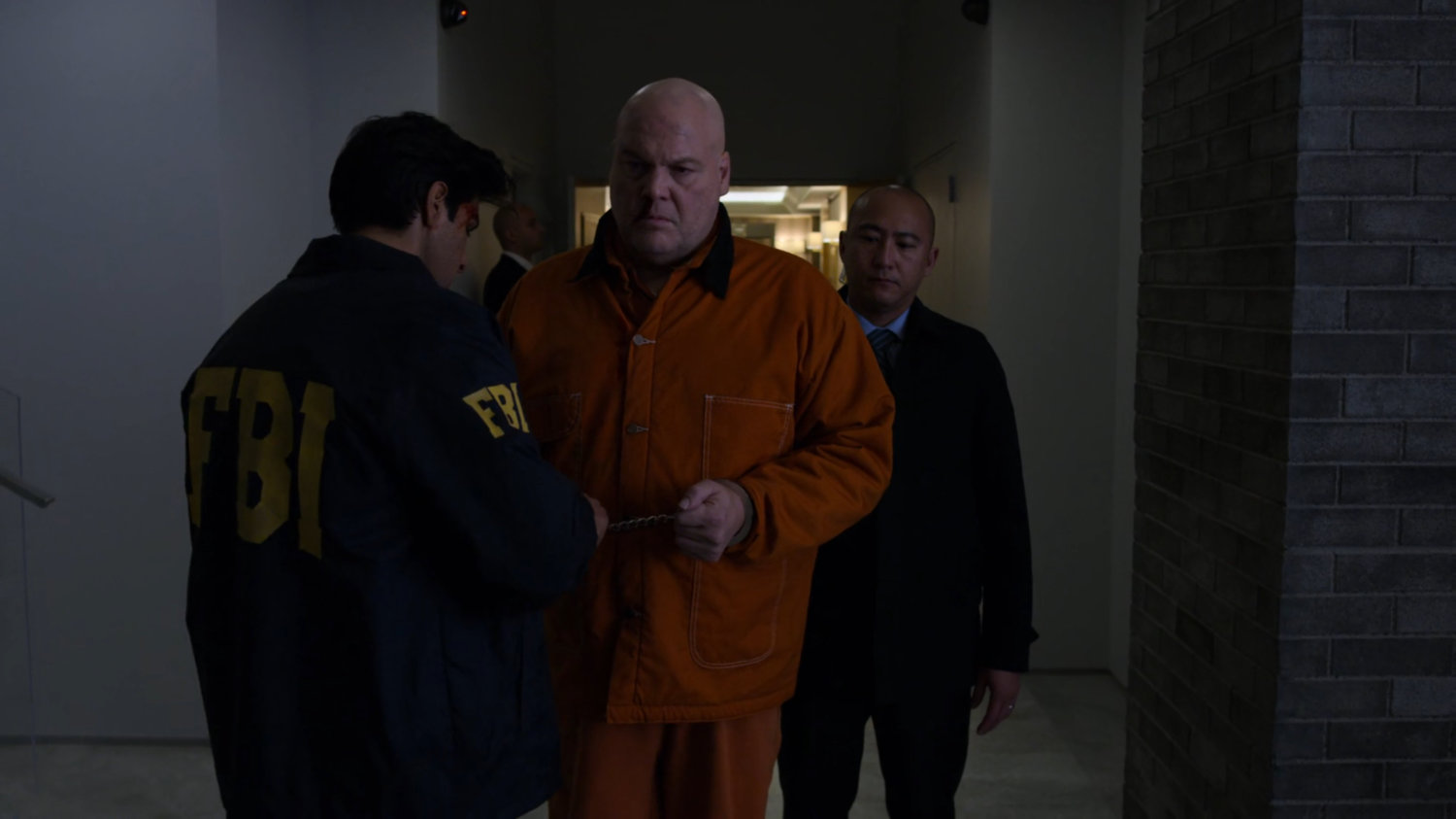 Fisk being uncuffed in the penthouse of the Presidential Hotel.
